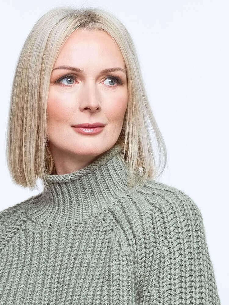 Beautiful woman in a green turtle neck